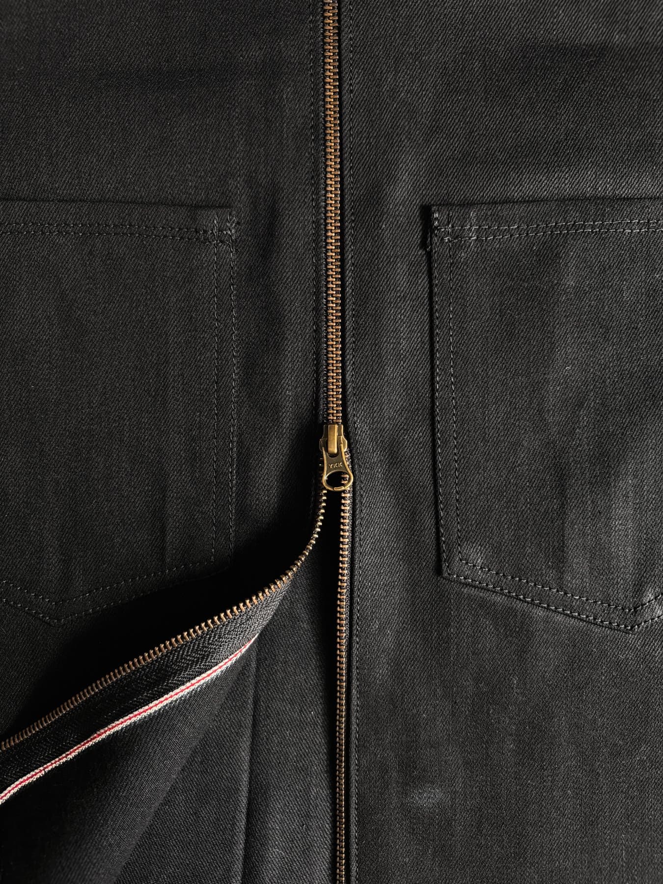 Selvage ID and brass YKK zip at the placket